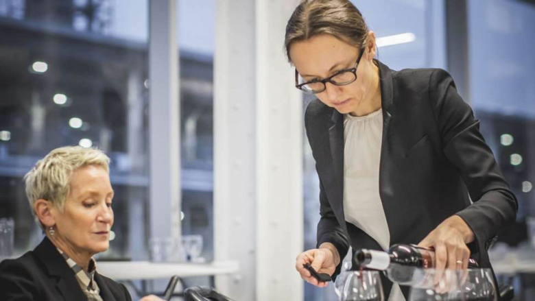 Pascaline Lepeltier pours wine for a judge at Somm360 in Montreal, 2018.