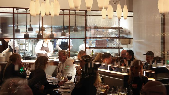 The open kitchen and dining room at Vinland brasserie, Oslo, Norway.