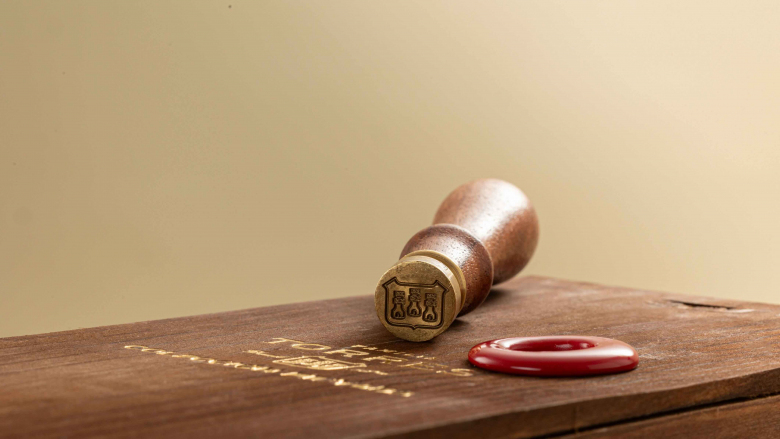 Familia Torres wooden wine box and wax seal.