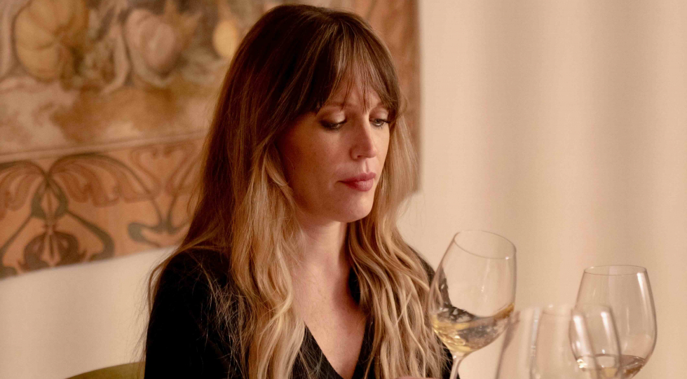 Milan Ambassador Cristina Mercuri with glasses of wine.