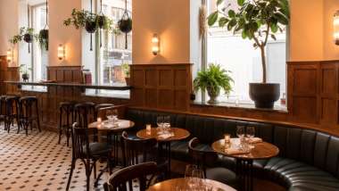 Dining tables at  Schmaltz Bar & Delicatessen in Stockholm, Sweden.