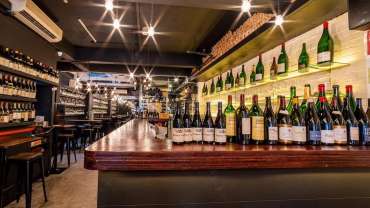 The bar and bottles at Le Quinze Vins wine bar in Singapore.