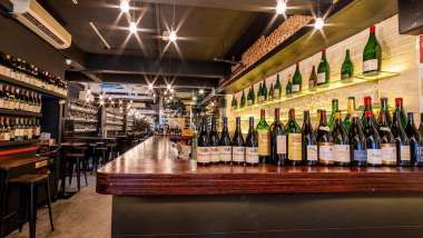 The bar and bottles at Le Quinze Vins wine bar in Singapore.