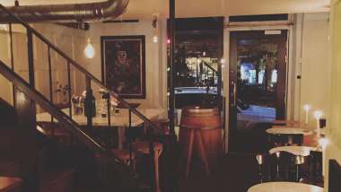 Tables inside Vina wine bar in Stockholm, Sweden.