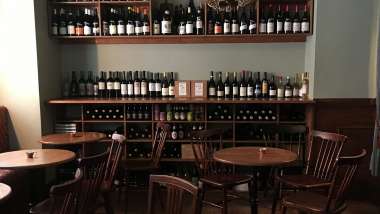 Tables and wine bottles at Ambar wine bar in Stockholm, Sweden.
