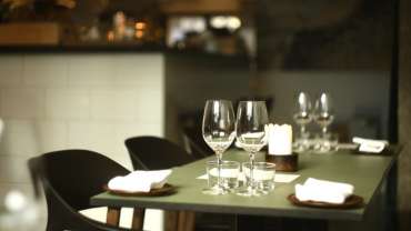 Tables and wine glasses at Prospero restaurant, Stockholm, Sweden.