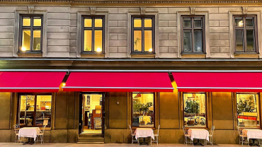 Exterior and terrace tables at Bergamott restaurant in Stockholm, Sweden.