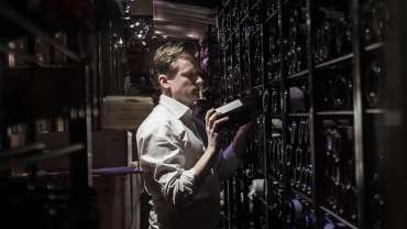 Sommelier in the cellar of Restaurang AG restaurant and wine bar in Stockholm, Sweden.