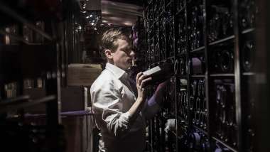 Sommelier in the cellar of Restaurang AG restaurant and wine bar in Stockholm, Sweden.