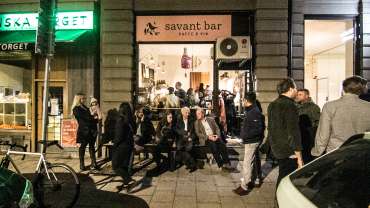 Guests outside Savant natural wine bar in Stockholm, Sweden.