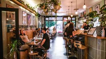 Guests in the interior of Good Gilbert wine bar in Adelaide, South Australia.