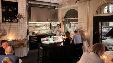 Kitchen and dining room at Bord restaurant and wine bar pizza in Stockholm, Sweden.
