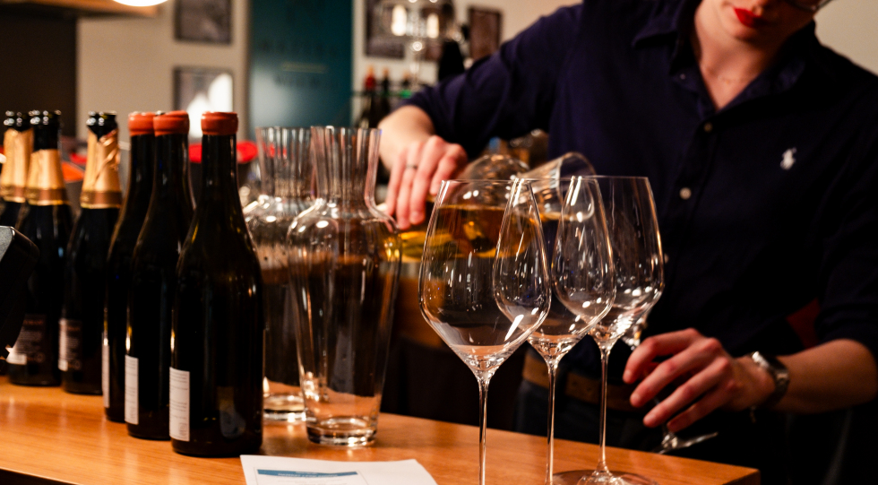 Pouring wine at Mazerat Wein.Wirt, Kufstein, Austria.