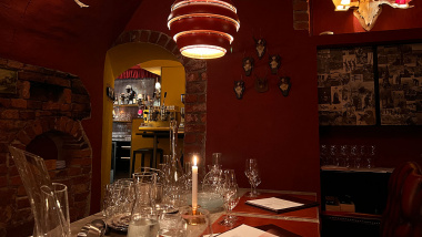 Atmospheric dining table and candles at Leijontornet restaurant in Stockholm, Sweden.