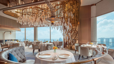 The dining room and city views at two-Michelin-star Jaan by Kirk Westaway restaurant at Swissôtel The Stamford, Singapore .