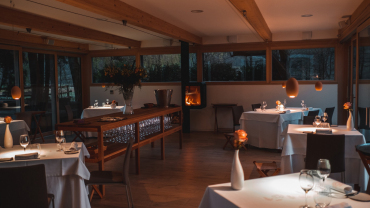 Interior tables at double Michelin star restaurant, Hiša Franko in Kobarid, Slovenia.