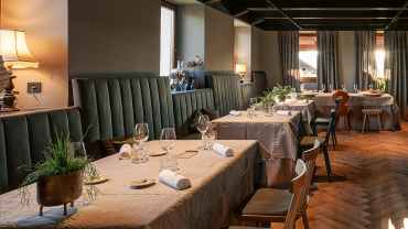 An interior shot of tables at Repovž restaurant, Šentjanž, Slovenia.