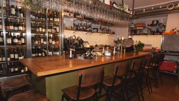 Wines behind the bar at Vinverket wine bar and restaurant in Stockholm, Sweden.