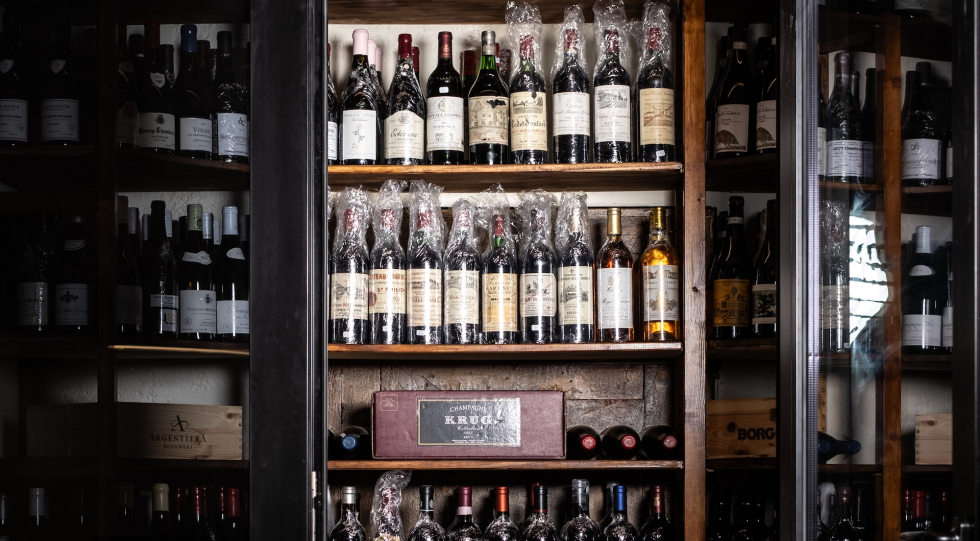 Wine shelves at restaurant Tomkat, Lucca, Italy.