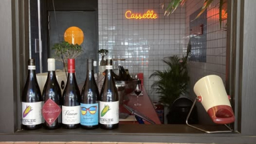 Bottles on the bar at Star Wine List Red Star: Cassette wine bar in Cape Town, South Africa.
