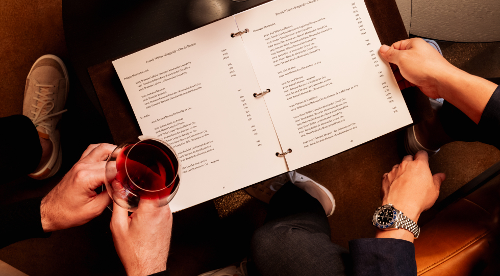 Perusing the wine list at Café Vivant, Menlo Park, California, USA.