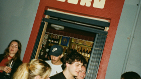Bustling crowd at wine bar Sin Cero, Cape Town, South Africa.
