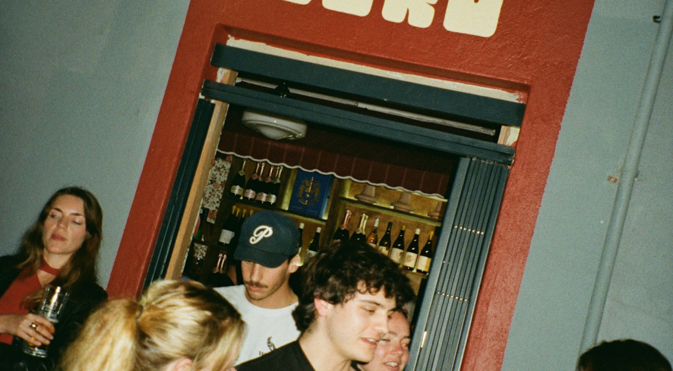 Bustling crowd at wine bar Sin Cero, Cape Town, South Africa.
