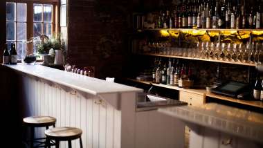 Interior and glasses at Clever Little Tailor wine bar in Adelaide, South Australia.