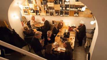 Guests in the dining room at Cork Vinbar wine bar and restaurant in Stockholm, Sweden.
